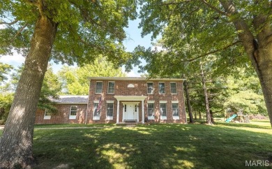 This stunning 2-story home offers 4 bedrooms, 2 full baths, and on Oak Meadow Country Club in Missouri - for sale on GolfHomes.com, golf home, golf lot