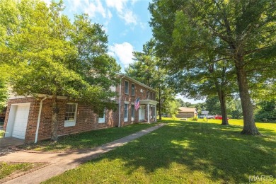 This stunning 2-story home offers 4 bedrooms, 2 full baths, and on Oak Meadow Country Club in Missouri - for sale on GolfHomes.com, golf home, golf lot
