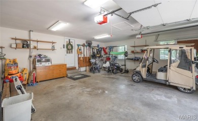 This stunning 2-story home offers 4 bedrooms, 2 full baths, and on Oak Meadow Country Club in Missouri - for sale on GolfHomes.com, golf home, golf lot