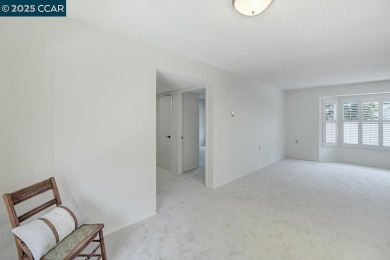 Delightful Del Monte Rossmoor Model! An upper unit with carport on Rossmoor Golf Course in California - for sale on GolfHomes.com, golf home, golf lot
