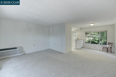 Delightful Del Monte Rossmoor Model! An upper unit with carport on Rossmoor Golf Course in California - for sale on GolfHomes.com, golf home, golf lot