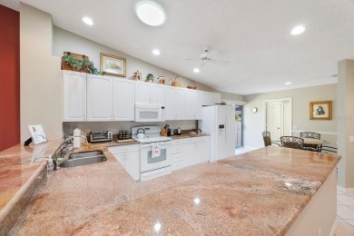 Beautifully UPDATED TURNKEY end unit villa with lots of natural on Palm Aire Country Club of Sarasota in Florida - for sale on GolfHomes.com, golf home, golf lot