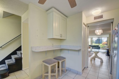 Beautifully maintained 3-bedroom, 3-bath corner unit on the golf on Fountains Golf and Country Club in Florida - for sale on GolfHomes.com, golf home, golf lot