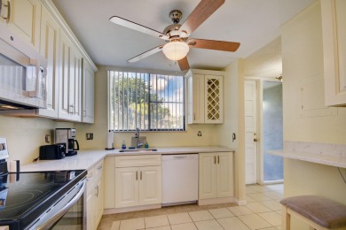Beautifully maintained 3-bedroom, 3-bath corner unit on the golf on Fountains Golf and Country Club in Florida - for sale on GolfHomes.com, golf home, golf lot