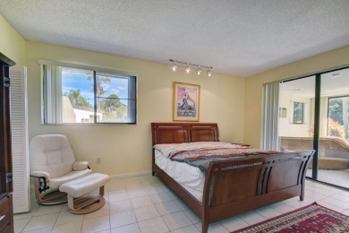 Beautifully maintained 3-bedroom, 3-bath corner unit on the golf on Fountains Golf and Country Club in Florida - for sale on GolfHomes.com, golf home, golf lot