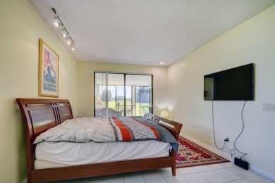 Beautifully maintained 3-bedroom, 3-bath corner unit on the golf on Fountains Golf and Country Club in Florida - for sale on GolfHomes.com, golf home, golf lot