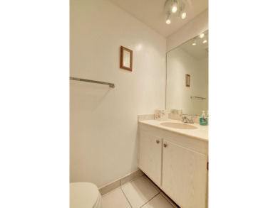 Beautifully maintained 3-bedroom, 3-bath corner unit on the golf on Fountains Golf and Country Club in Florida - for sale on GolfHomes.com, golf home, golf lot