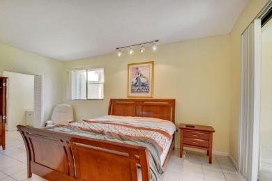 Beautifully maintained 3-bedroom, 3-bath corner unit on the golf on Fountains Golf and Country Club in Florida - for sale on GolfHomes.com, golf home, golf lot