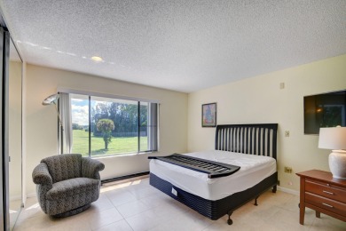 Beautifully maintained 3-bedroom, 3-bath corner unit on the golf on Fountains Golf and Country Club in Florida - for sale on GolfHomes.com, golf home, golf lot