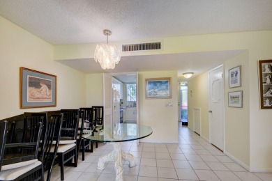 Beautifully maintained 3-bedroom, 3-bath corner unit on the golf on Fountains Golf and Country Club in Florida - for sale on GolfHomes.com, golf home, golf lot