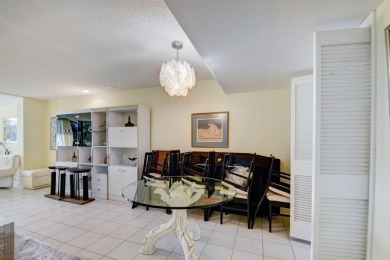 Beautifully maintained 3-bedroom, 3-bath corner unit on the golf on Fountains Golf and Country Club in Florida - for sale on GolfHomes.com, golf home, golf lot