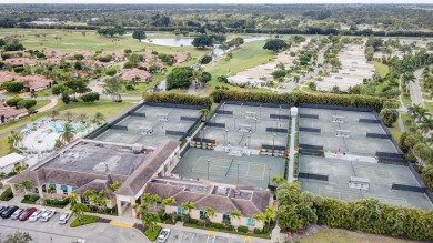 Beautifully maintained 3-bedroom, 3-bath corner unit on the golf on Fountains Golf and Country Club in Florida - for sale on GolfHomes.com, golf home, golf lot