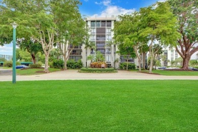 Enjoy tranquil golf course vistas from all angles and the on Boca West Golf and Country Club in Florida - for sale on GolfHomes.com, golf home, golf lot