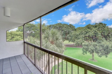Enjoy tranquil golf course vistas from all angles and the on Boca West Golf and Country Club in Florida - for sale on GolfHomes.com, golf home, golf lot