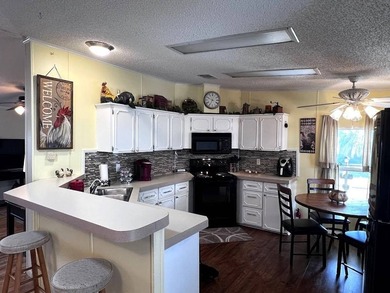 This stunning 2 bedroom, 2 bath home has been thoughtfully on Lake Henry Golf Club in Florida - for sale on GolfHomes.com, golf home, golf lot