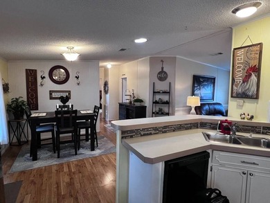 This stunning 2 bedroom, 2 bath home has been thoughtfully on Lake Henry Golf Club in Florida - for sale on GolfHomes.com, golf home, golf lot