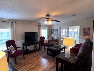 This stunning 2 bedroom, 2 bath home has been thoughtfully on Lake Henry Golf Club in Florida - for sale on GolfHomes.com, golf home, golf lot