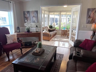 This stunning 2 bedroom, 2 bath home has been thoughtfully on Lake Henry Golf Club in Florida - for sale on GolfHomes.com, golf home, golf lot