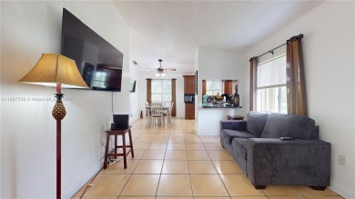 This beautifully updated condo in Bonita Golf View Villas is on Country Club of Miami in Florida - for sale on GolfHomes.com, golf home, golf lot