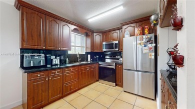 This beautifully updated condo in Bonita Golf View Villas is on Country Club of Miami in Florida - for sale on GolfHomes.com, golf home, golf lot