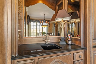 Stunning European-inspired home on Loch Lloyd's iconic 18th hole on Loch Lloyd Country Club in Missouri - for sale on GolfHomes.com, golf home, golf lot