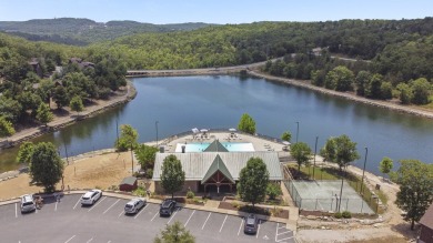 Immerse yourself in the rustic charm of this picturesque on Ledgestone Country Club and Golf Course in Missouri - for sale on GolfHomes.com, golf home, golf lot