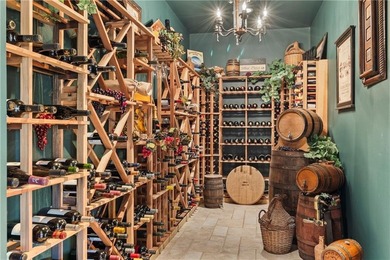 Stunning European-inspired home on Loch Lloyd's iconic 18th hole on Loch Lloyd Country Club in Missouri - for sale on GolfHomes.com, golf home, golf lot