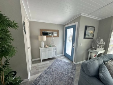 Lot Rent $1075 monthly     This beautiful 2-bedroom, 2 bathroom on Del Tura Golf and Country Club in Florida - for sale on GolfHomes.com, golf home, golf lot