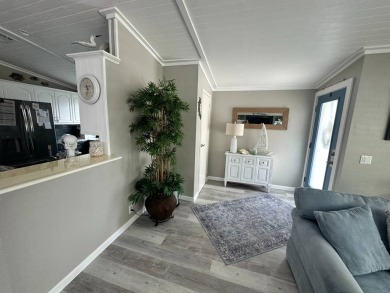 Lot Rent $1075 monthly     This beautiful 2-bedroom, 2 bathroom on Del Tura Golf and Country Club in Florida - for sale on GolfHomes.com, golf home, golf lot