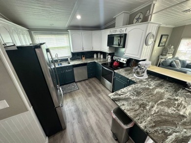 Lot Rent $1075 monthly     This beautiful 2-bedroom, 2 bathroom on Del Tura Golf and Country Club in Florida - for sale on GolfHomes.com, golf home, golf lot