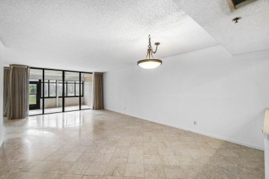 Welcome to this beautifully maintained first-floor corner condo on The Country Club At Boca Raton in Florida - for sale on GolfHomes.com, golf home, golf lot
