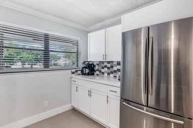 Welcome to 12926 Briarlake Dr #201 - a beautifully updated on Old Marsh Golf Club in Florida - for sale on GolfHomes.com, golf home, golf lot