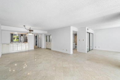 Welcome to this beautifully maintained first-floor corner condo on The Country Club At Boca Raton in Florida - for sale on GolfHomes.com, golf home, golf lot