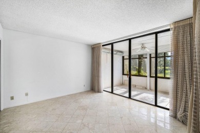Welcome to this beautifully maintained first-floor corner condo on The Country Club At Boca Raton in Florida - for sale on GolfHomes.com, golf home, golf lot