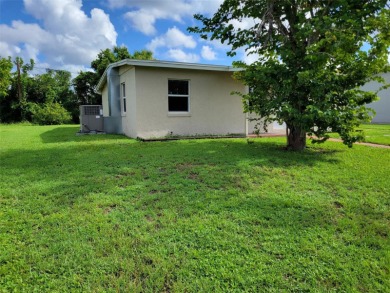 Solidly-constructed, compact home with tile floors throughout on Port Charlotte Golf Club in Florida - for sale on GolfHomes.com, golf home, golf lot