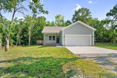 Beautiful 2-year-old home in the gated Linn Valley Lakes on Linn Valley Lakes - Deer Trace Golf Course in Kansas - for sale on GolfHomes.com, golf home, golf lot