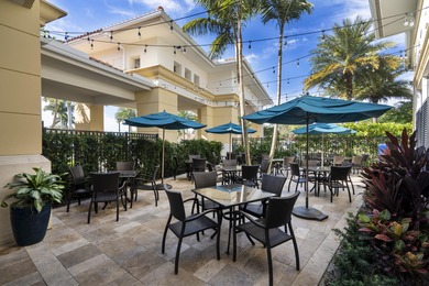 PRICED TO SELL WITH A NEW ROOF! WELCOME TO YOUR SANCTUARY IN THE on PGA National Estates Golf Course in Florida - for sale on GolfHomes.com, golf home, golf lot