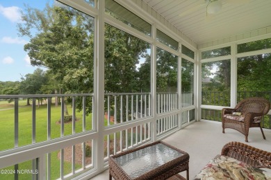 Sit on your enclosed porch and watch the golfers, gators, and on Sea Trail Golf Resort in North Carolina - for sale on GolfHomes.com, golf home, golf lot