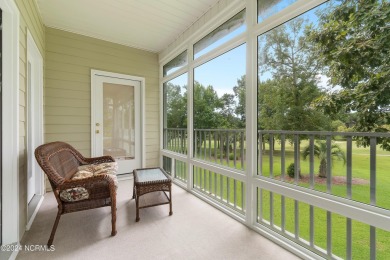 Sit on your enclosed porch and watch the golfers, gators, and on Sea Trail Golf Resort in North Carolina - for sale on GolfHomes.com, golf home, golf lot