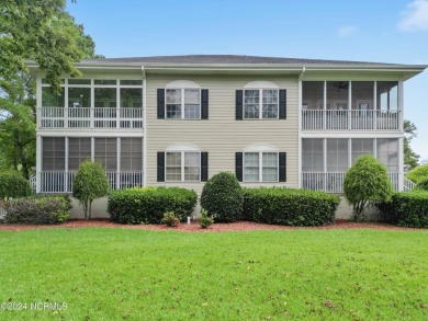 Sit on your enclosed porch and watch the golfers, gators, and on Sea Trail Golf Resort in North Carolina - for sale on GolfHomes.com, golf home, golf lot