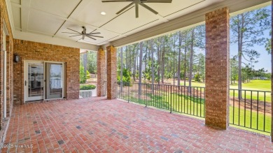 This stately all-brick home overlooking the 6th green of on The National Golf Club in North Carolina - for sale on GolfHomes.com, golf home, golf lot
