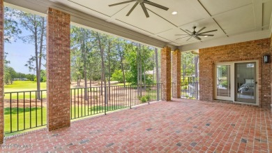 This stately all-brick home overlooking the 6th green of on The National Golf Club in North Carolina - for sale on GolfHomes.com, golf home, golf lot