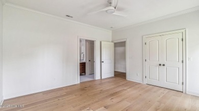 This stately all-brick home overlooking the 6th green of on The National Golf Club in North Carolina - for sale on GolfHomes.com, golf home, golf lot