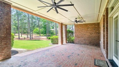 This stately all-brick home overlooking the 6th green of on The National Golf Club in North Carolina - for sale on GolfHomes.com, golf home, golf lot