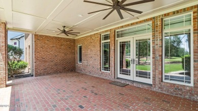 This stately all-brick home overlooking the 6th green of on The National Golf Club in North Carolina - for sale on GolfHomes.com, golf home, golf lot