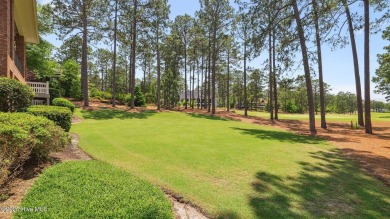 This stately all-brick home overlooking the 6th green of on The National Golf Club in North Carolina - for sale on GolfHomes.com, golf home, golf lot