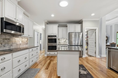 Welcome home to this beautifully maintained 4-bedroom, 4-bath on Compass Pointe Golf Course in North Carolina - for sale on GolfHomes.com, golf home, golf lot