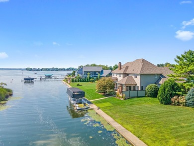 Experience refined waterfront living on Lake Wawasee in this on Wawasee Golf Club in Indiana - for sale on GolfHomes.com, golf home, golf lot