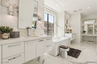 Experience sweeping Strip and mountain views from this elegant on Dragon Ridge Country Club in Nevada - for sale on GolfHomes.com, golf home, golf lot