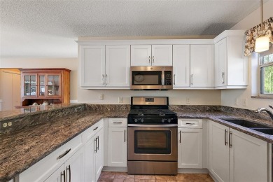 GORGEOUS, TURNKEY 2/2 Loredo with ENCLOSED, CLIMATE-CONTROLLED on The Links of Spruce Creek in Florida - for sale on GolfHomes.com, golf home, golf lot